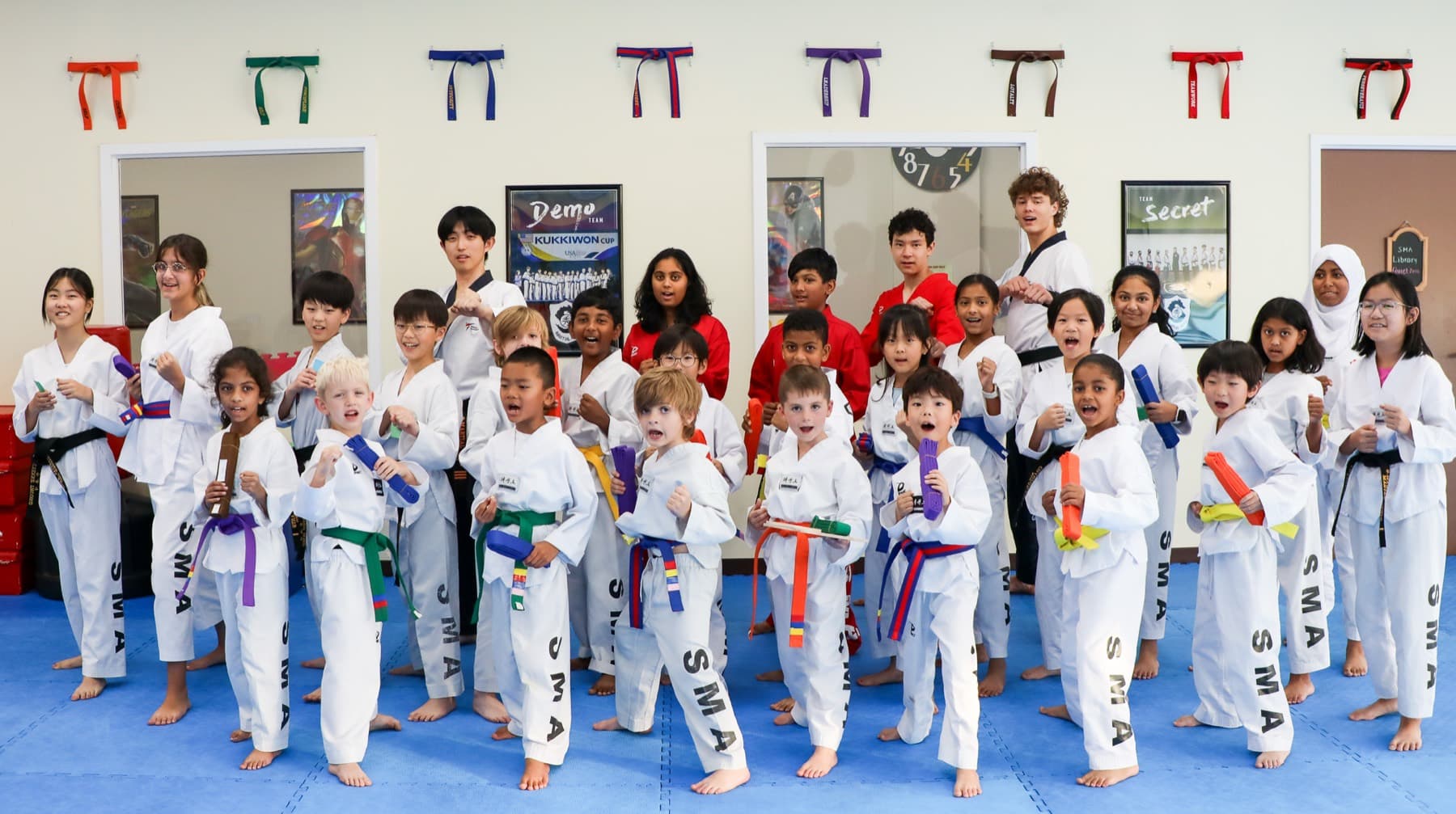 Children training Taekwondo with an instructor at S Martial Arts